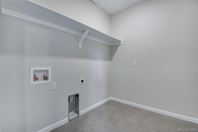 washroom with hookup for an electric dryer and hookup for a washing machine