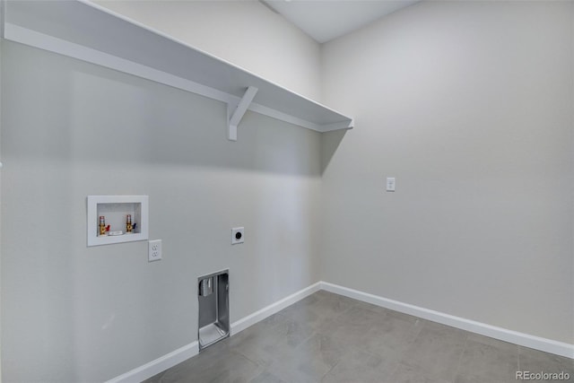 laundry area with laundry area, hookup for a washing machine, hookup for an electric dryer, and baseboards