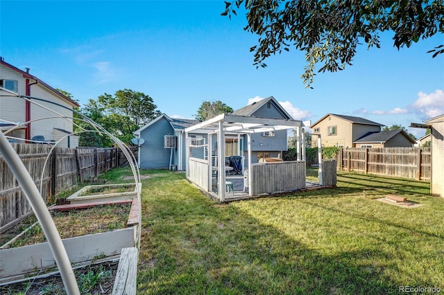 16980 E Stanford Ave, Aurora, CO 80015 - fenced backyard with a vegetable garden and an outbuilding