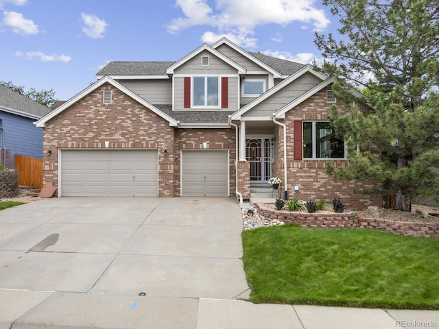 6432 S Robb Ct, Littleton, CO 80127 - view of front of house with driveway, brick siding, a front lawn, a shingled roof, and a garage