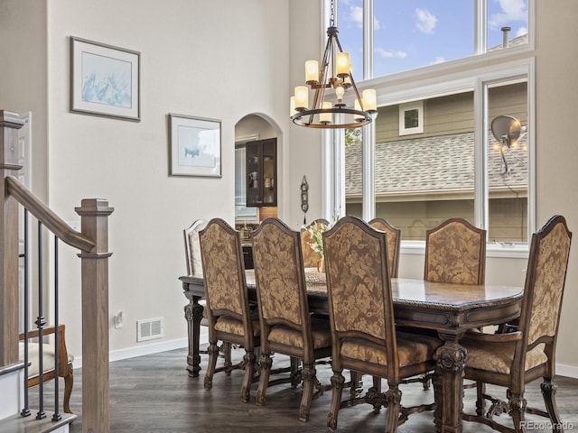6432 S Robb Ct, Littleton, CO 80127 - dining space featuring a chandelier, dark wood-style floors, and baseboards