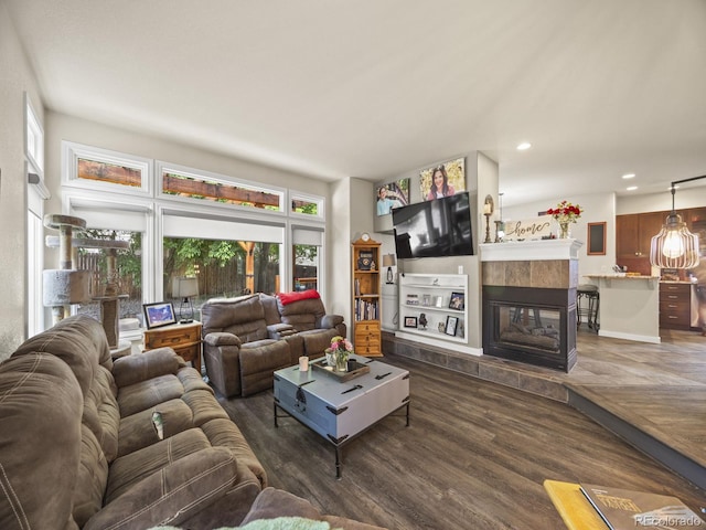 6432 S Robb Ct, Littleton, CO 80127 - living area featuring dark wood finished floors, a tiled fireplace, and recessed lighting