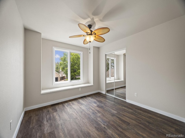 6432 S Robb Ct, Littleton, CO 80127 - spare room featuring dark wood-style floors, ceiling fan, and baseboards