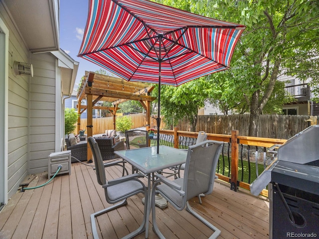 6432 S Robb Ct, Littleton, CO 80127 - wooden terrace with outdoor dining area, a fenced backyard, an outdoor living space, and a grill