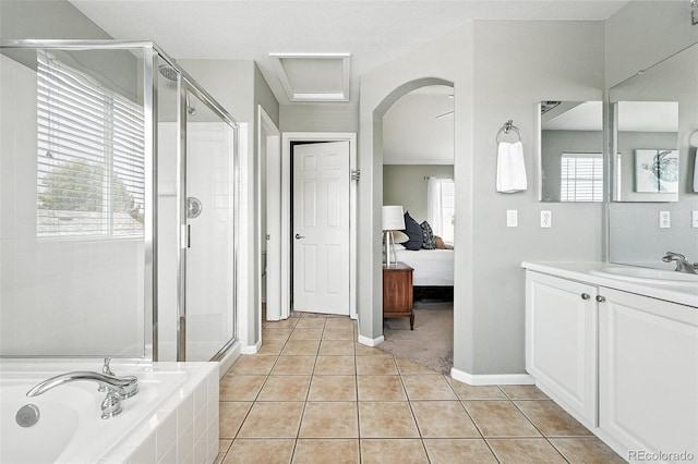 3543 Foxridge Trl, Highlands Ranch, CO 80126 - ensuite bathroom featuring tile patterned floors, vanity, a shower stall, and a bath