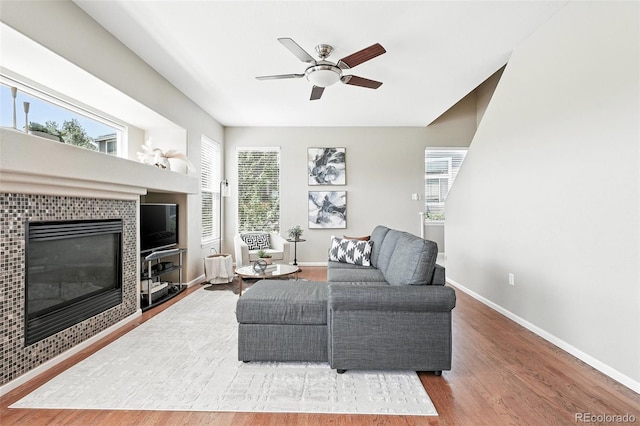 3543 Foxridge Trl, Highlands Ranch, CO 80126 - living room with a ceiling fan, a tile fireplace, and wood finished floors