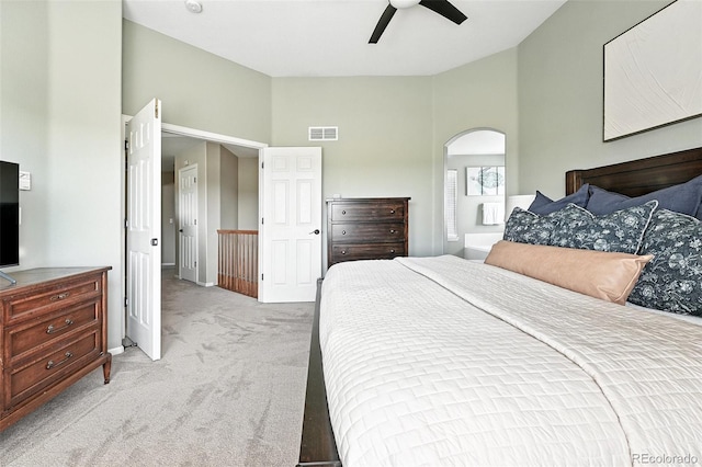 3543 Foxridge Trl, Highlands Ranch, CO 80126 - bedroom featuring light carpet, arched walkways, high vaulted ceiling, and a ceiling fan