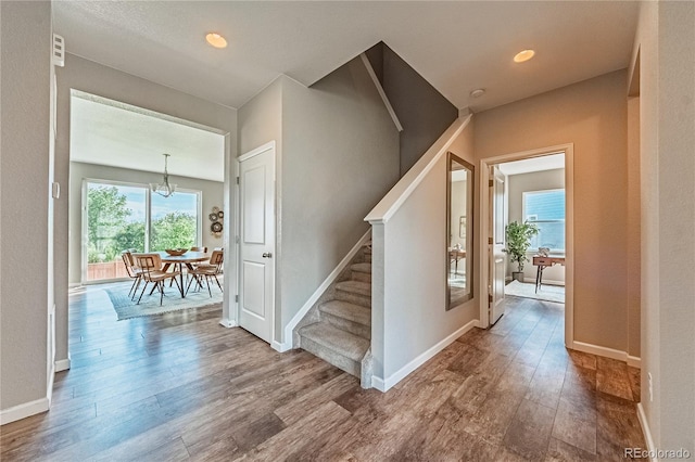638 W 175th Ave, Broomfield, CO 80023 - staircase featuring wood finished floors and a chandelier