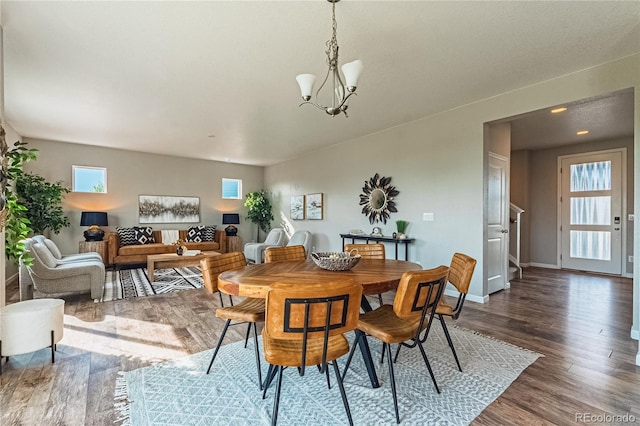 638 W 175th Ave, Broomfield, CO 80023 - dining room featuring dark wood-style flooring and a chandelier