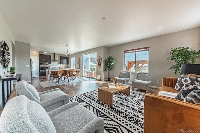 638 W 175th Ave, Broomfield, CO 80023 - living area with dark wood-type flooring, plenty of natural light, and a chandelier
