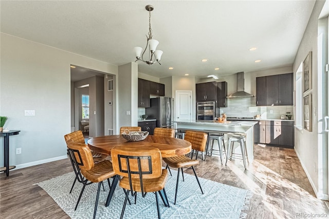 638 W 175th Ave, Broomfield, CO 80023 - dining room with a chandelier, light wood-style flooring, and recessed lighting