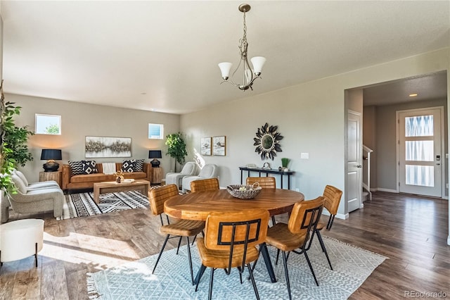 638 W 175th Ave, Broomfield, CO 80023 - dining space featuring a chandelier and dark wood-style flooring