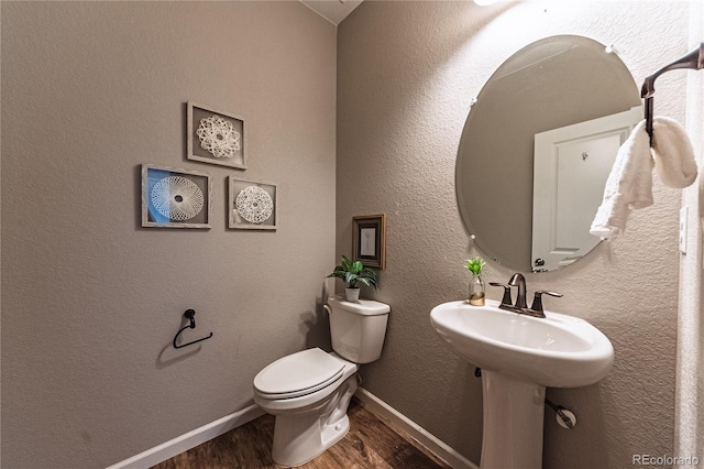 638 W 175th Ave, Broomfield, CO 80023 - half bathroom featuring wood finished floors and toilet