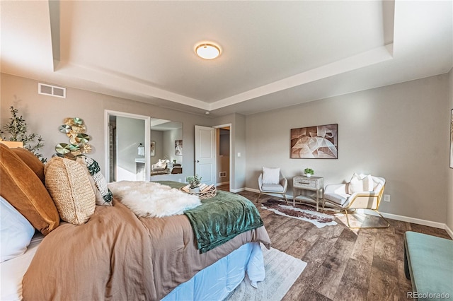 638 W 175th Ave, Broomfield, CO 80023 - bedroom with a tray ceiling and wood finished floors