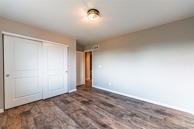 638 W 175th Ave, Broomfield, CO 80023 - unfurnished bedroom with dark wood-style floors and a closet