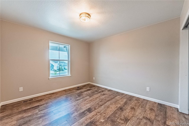 638 W 175th Ave, Broomfield, CO 80023 - spare room with wood finished floors and baseboards
