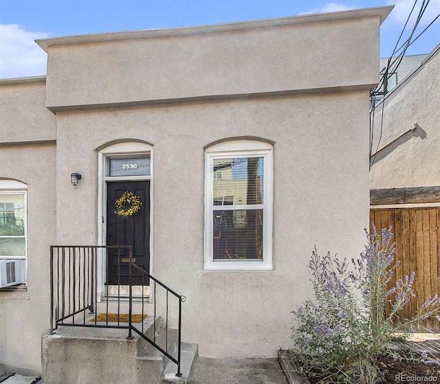 2530 Kensing Ct, Denver, CO 80211 - property entrance featuring stucco siding and cooling unit