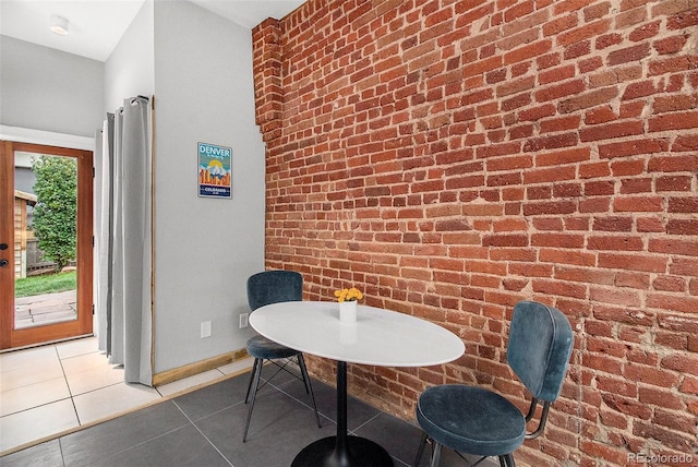 2530 Kensing Ct, Denver, CO 80211 - tiled dining area with brick wall