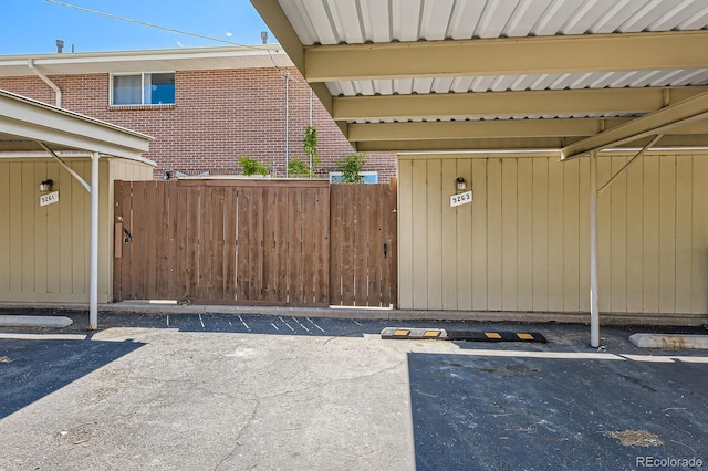 9263 E Nassau Ave, Denver, CO 80237 - view of exterior entry featuring brick siding and covered parking