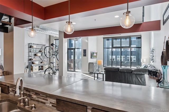 kitchen featuring sink and hanging light fixtures