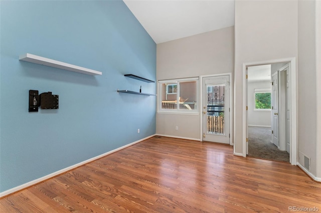 4195 W 111th Cir, Westminster, CO 80031 - spare room featuring wood finished floors, baseboards, and a high ceiling