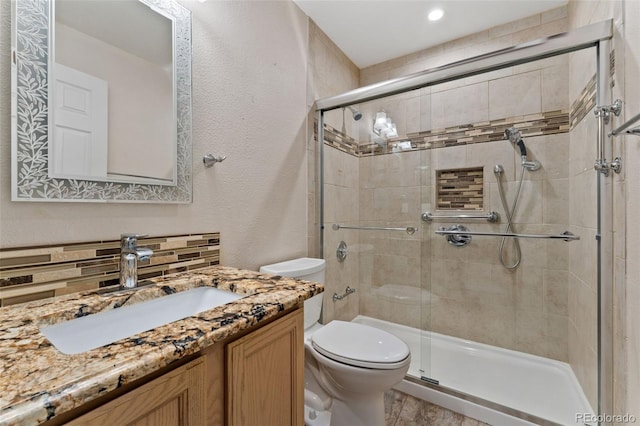 4195 W 111th Cir, Westminster, CO 80031 - bathroom with toilet, a shower stall, vanity, and a textured wall