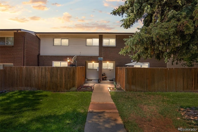 view of front of property with a yard