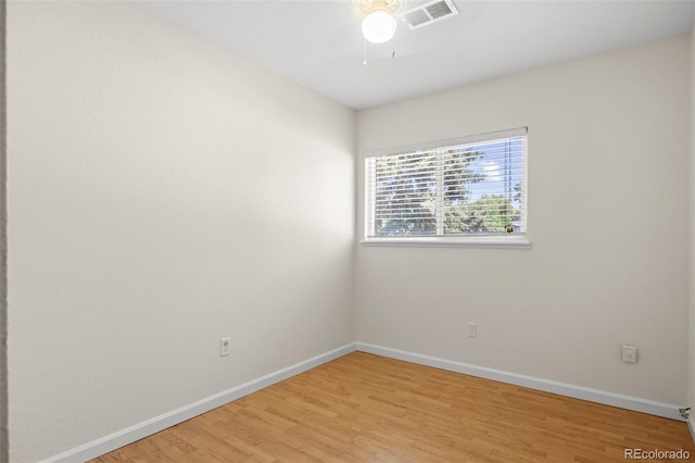 empty room featuring light wood-type flooring and ceiling fan