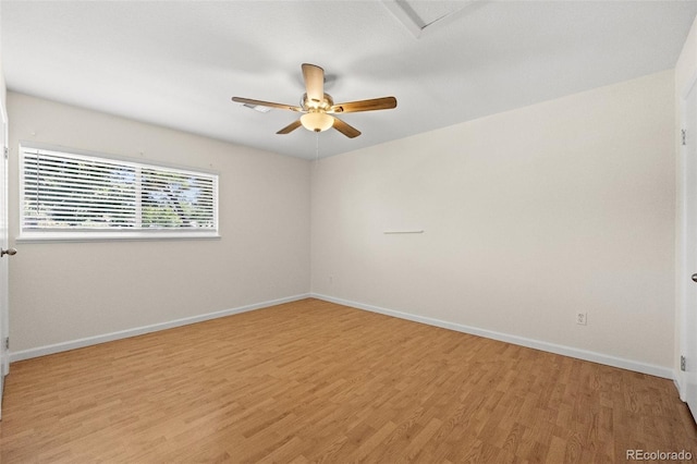 empty room with light hardwood / wood-style floors and ceiling fan