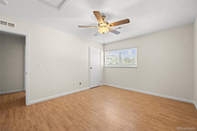 unfurnished room with ceiling fan and light hardwood / wood-style flooring