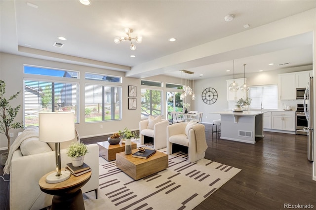 6689 Backcountry Loop, Colorado Springs, CO 80927 - living room featuring a chandelier, dark wood-style flooring, and recessed lighting