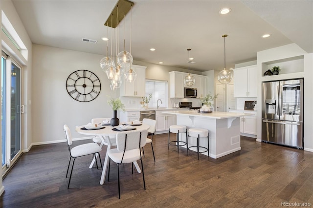 6689 Backcountry Loop, Colorado Springs, CO 80927 - dining area featuring dark wood finished floors and recessed lighting