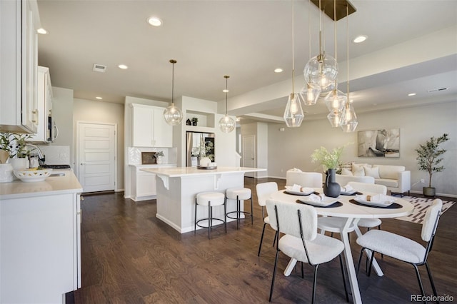 6689 Backcountry Loop, Colorado Springs, CO 80927 - dining space featuring dark wood-style floors and recessed lighting