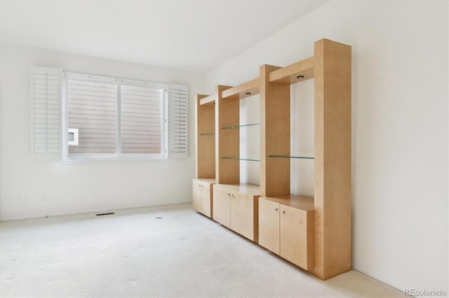 mudroom with light colored carpet