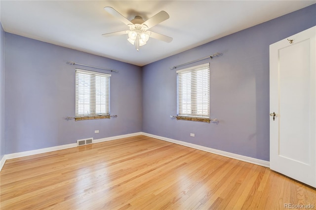 2285 N Monaco Pkwy, Denver, CO 80207 - spare room featuring a ceiling fan, wood finished floors, and baseboards