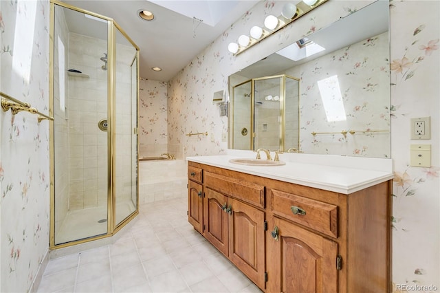 2285 N Monaco Pkwy, Denver, CO 80207 - bathroom featuring a skylight, wallpapered walls, a shower stall, a garden tub, and vanity