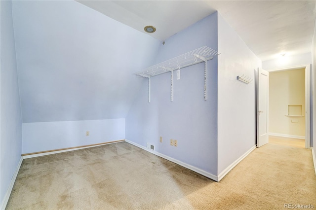 2285 N Monaco Pkwy, Denver, CO 80207 - unfurnished room featuring carpet, baseboards, and lofted ceiling