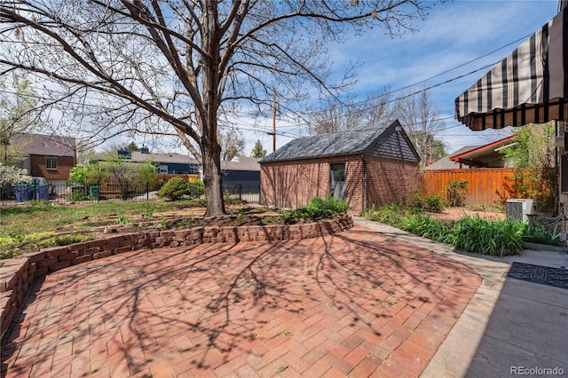 2285 N Monaco Pkwy, Denver, CO 80207 - view of patio featuring fence and an outdoor structure