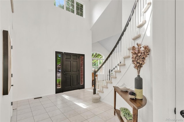 7420 S Houstoun Waring Cir, Littleton, CO 80120 - entryway with a high ceiling, tile patterned flooring, and stairway