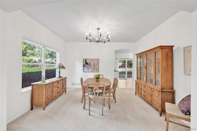 7420 S Houstoun Waring Cir, Littleton, CO 80120 - dining room featuring light carpet, a chandelier, plenty of natural light, and arched walkways