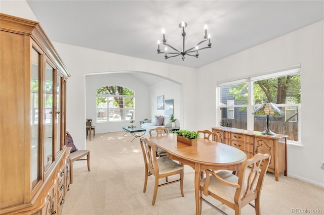 7420 S Houstoun Waring Cir, Littleton, CO 80120 - dining room with light colored carpet, a chandelier, and arched walkways