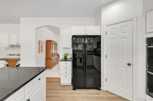 7420 S Houstoun Waring Cir, Littleton, CO 80120 - kitchen featuring black appliances, light wood finished floors, white cabinetry, and tasteful backsplash