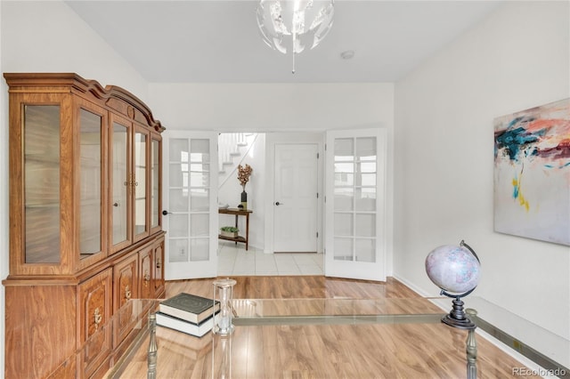 7420 S Houstoun Waring Cir, Littleton, CO 80120 - foyer with french doors, stairs, wood finished floors, and ceiling fan