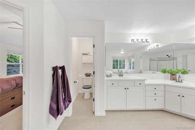7420 S Houstoun Waring Cir, Littleton, CO 80120 - full bathroom featuring connected bathroom, double vanity, tile patterned floors, and a shower stall