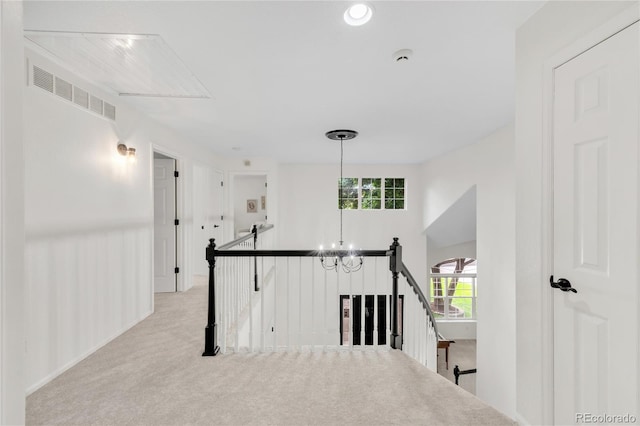 7420 S Houstoun Waring Cir, Littleton, CO 80120 - hall featuring an upstairs landing, light carpet, and a chandelier