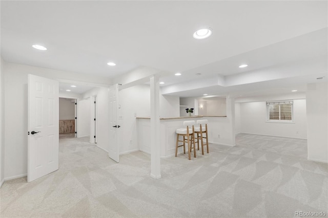 7420 S Houstoun Waring Cir, Littleton, CO 80120 - finished basement with light colored carpet, recessed lighting, and bar area