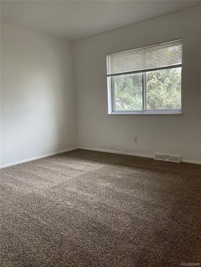4115 S Vincennes Ct, Denver, CO 80237 - carpeted empty room with baseboards