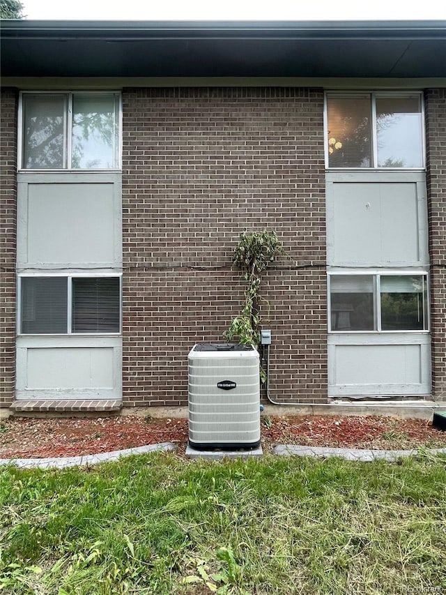 4115 S Vincennes Ct, Denver, CO 80237 - exterior view of central AC and brick siding