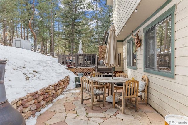 view of snow covered patio