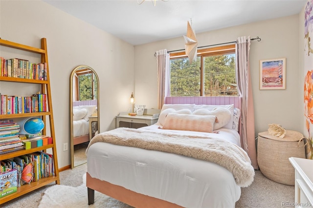 bedroom featuring light colored carpet